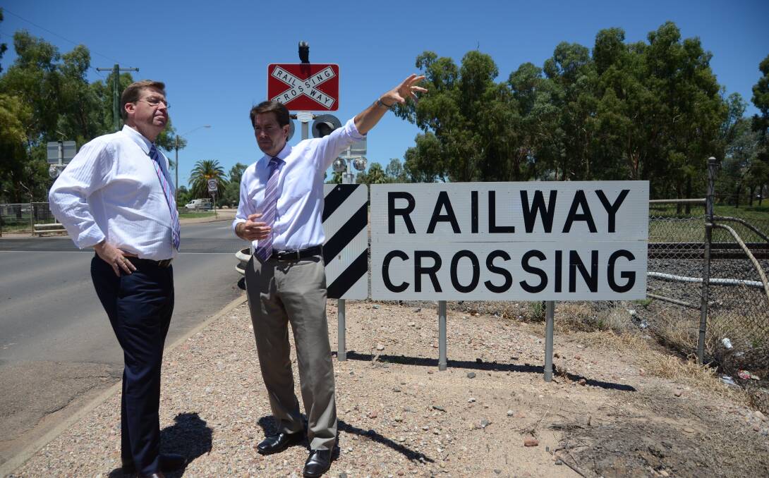 Former deputy premier Troy Grant with Member for Tamworth Kevin Anderson at the proposed overpass site in 2015.