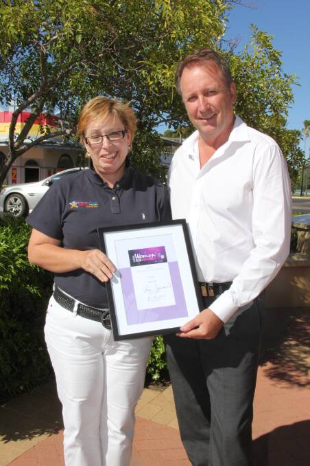 GREAT ACHIEVEMENT: Kelly Foran receives a certificate from Barwon MP Kevin Humphries after being nominated for NSW Woman of the Year Barwon Area.