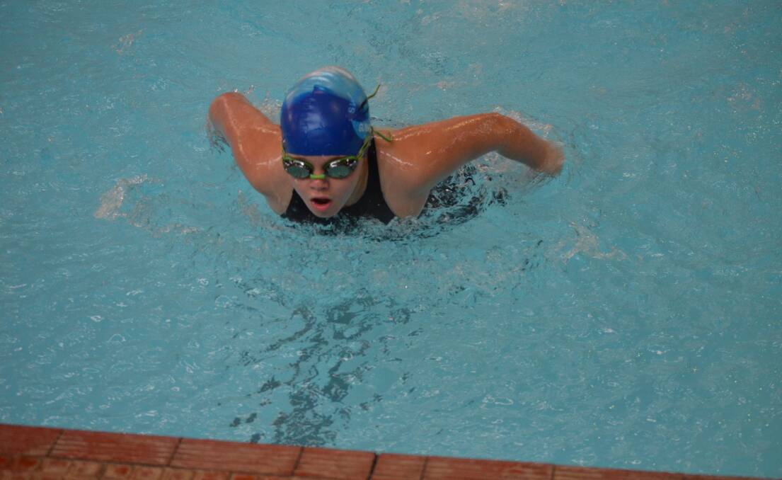 EFFORT: Ava Hannaford, 11, powers to the wall in the butterfly. Ava shaved almost 10 seconds off her PB in the medley.