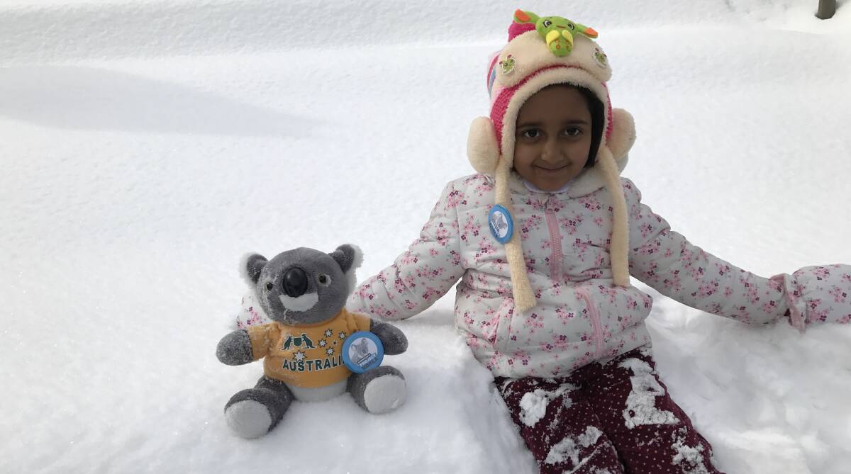 Ready to make snow angels: Maheen Tariq with her koala in the snow of Northern Pakistan.