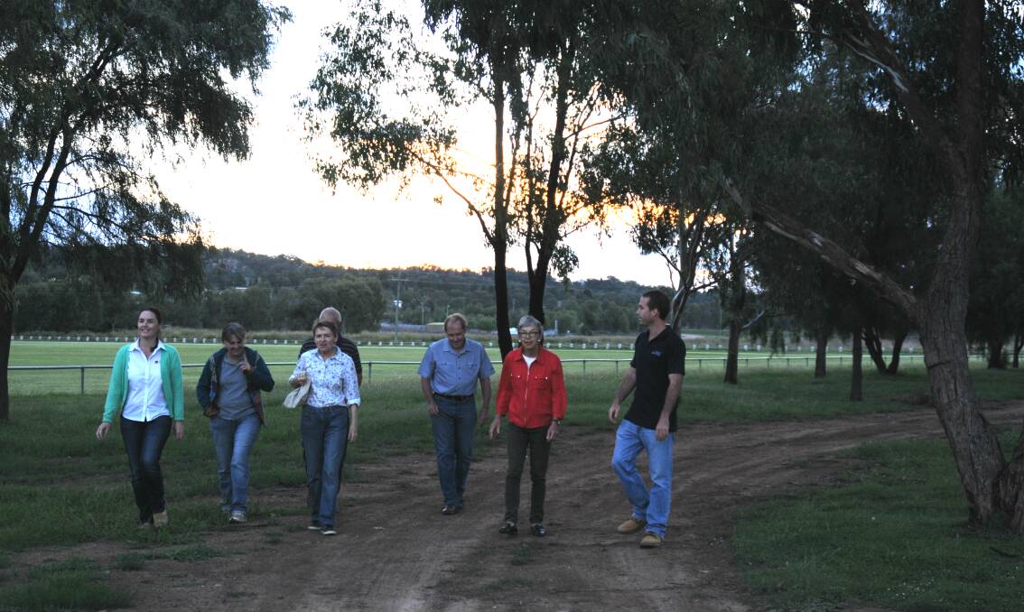 Taking a look: Project Koala sub-committee members take a look around a riverbank area. A revegetation project is planned for an area nearby.