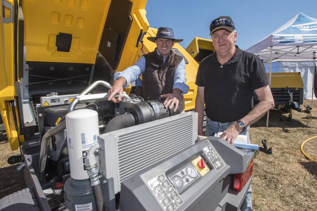 ON SHOW: Moree-based Compressed Air, Light & Power's Joff Cannington talks with customer Rod Harris at AgQuip. Photo: Peter Hardin