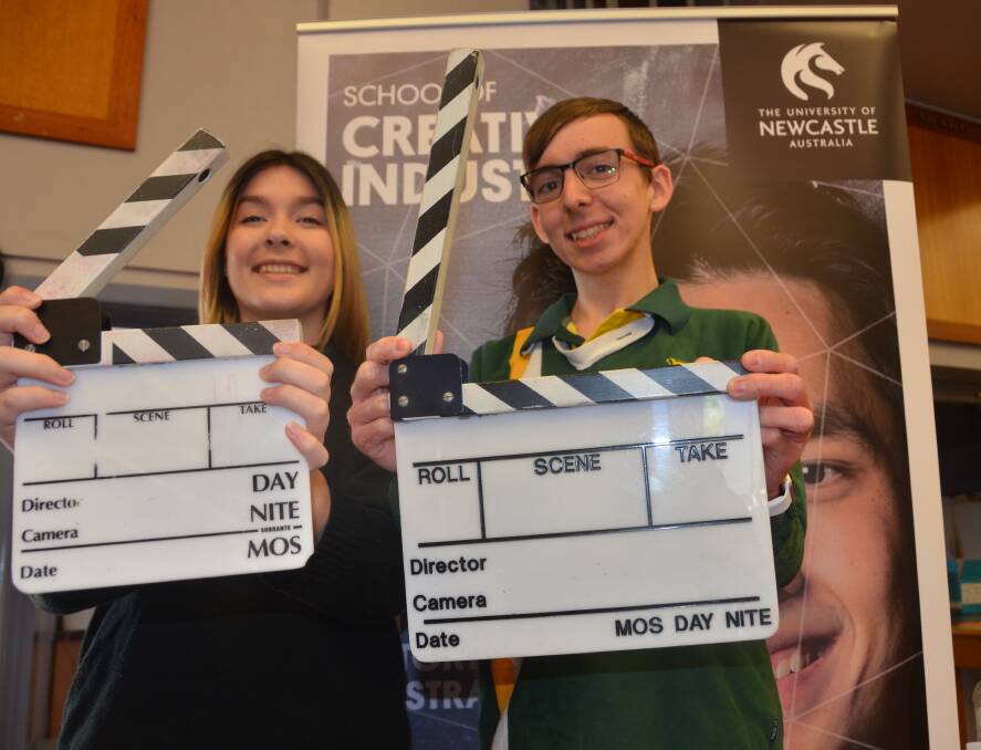 ACTION: Gunnedah High School year 10 students Angela Petersen and Coby Higgins soak up the action of University of Newcastle's Creative Industries Roadshow in Gunnedah on Wednesday. Photo: Ella Smith 