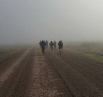 RE-ENACTMENT: Twelve men run the 40 kilometres from Breeza back to town along the Pullaming stock route on Sunday to honour Cumbo Gunnerah and his men as part of NAIDOC Week celebrations. Picture: Contributed
