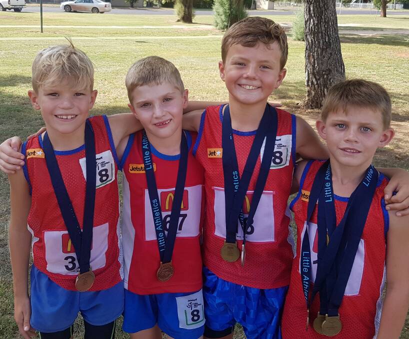 In form: Gunnedah Little Athletics Club under-8 talents Oliver Shoesmith, Keaton Walters, Haydon Sawyer and Harry Ryman with their medals from the regionals at Lismore. 