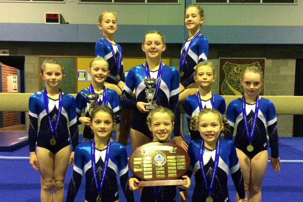 Successful meet: Gunnedah Gymnastics Centre members with the spoils of their efforts at the recent Country Championships.