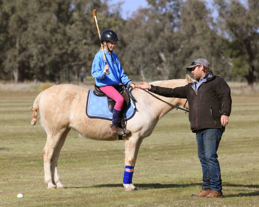 Helping hand: Charlotte Craig riding Sophie receives some tuition from Andrew Williams. Photo: Elesa Art Studios