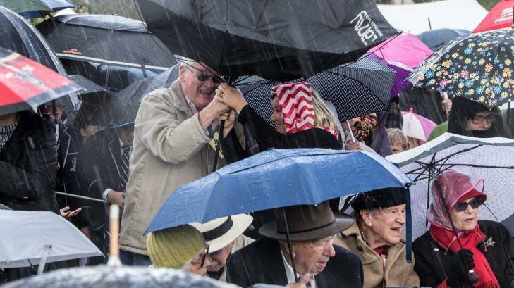 Torrential ran sweeps an Anzac commemoration.  Photo: Jason South