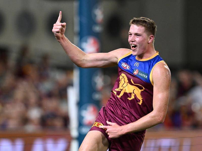 Debutant Logan Morris celebrates his first AFL goal in the Lions' win over the Suns. (Darren England/AAP PHOTOS)