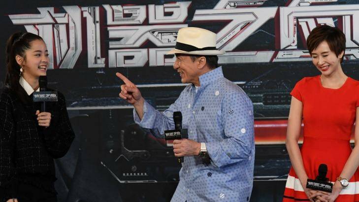 Jackie Chan and his co-stars in <i>Bleeding Steel</i> appeared in Sydney on Thursday; Nana Ouyang, on his left, and Erica Xia-hou. The movie is the biggest budget Chinese production ever shot here. Photo: Peter Rae