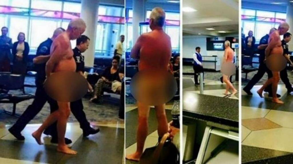 Photos of the man being escorted from Charlotte Douglas airport in North Carolina.