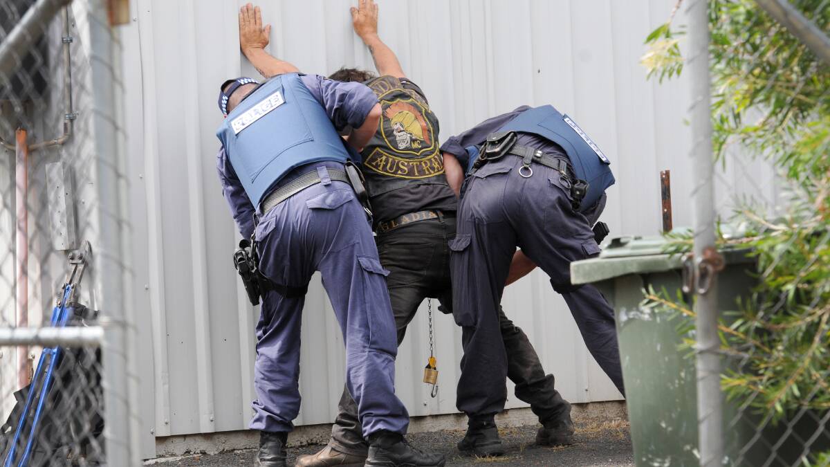 SHOW OF FORCE: Officers from Strike Force Raptor have swooped on the headquarters of Gunnedah’s Gladiators outlaw motorcycle gang. Photos: Gareth Gardner  040414GGE10/