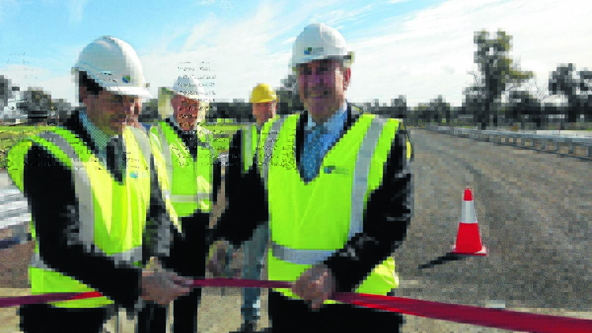 Member for Tamworth Kevin Anderson (left) and Minister for Roads Duncan Gay officially open the bridge.