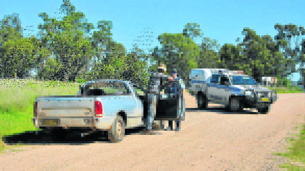Local farmer Cliff Wallace was stopped by a police road block on Therribri Rd.