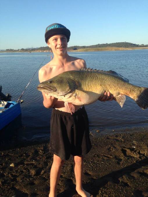 Young Keighan Woodhead with his prize catch. The Cod they said, which was caught at Lake Keepit recently, measured at least 100cm.