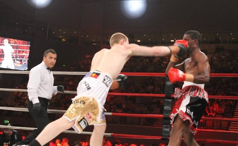 Kye (left) fighting Clive Atwell when Kye won the WBA Pan Asian Pacific Title at Hisense Arena in Melbourne in November.