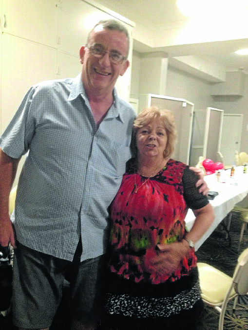 STANDING tall.  John Blackburn with Kerrie Muller at Kerrie’s 60th birthday party.