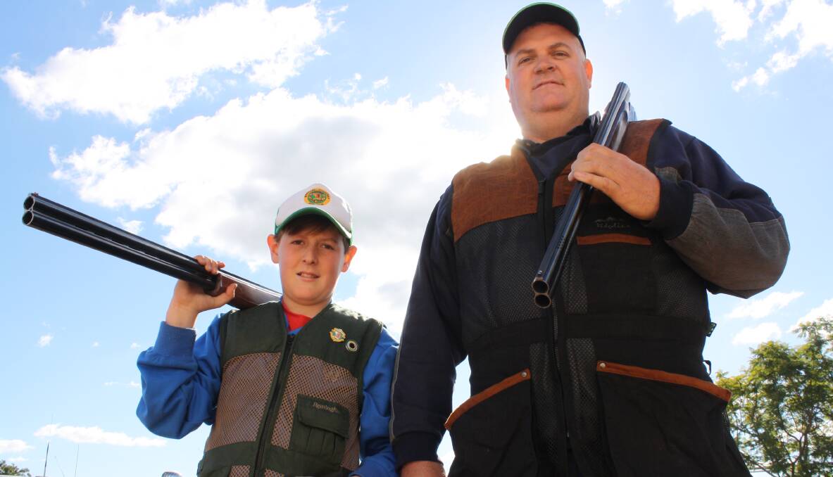 Father son clay target shooters Eli Kelly, 12, with dad Scott in the lead-up to this weekend’s Westpac Rescue Helicopter charity shoot. Photos: Sam Woods