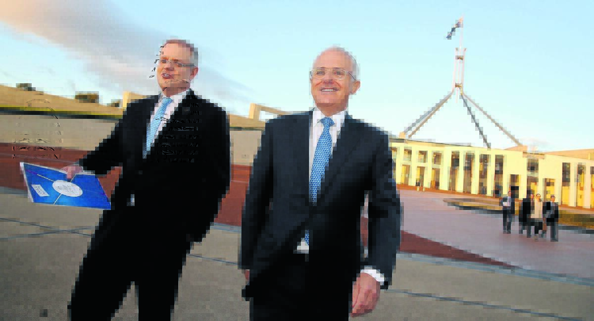 Treasurer Scott Morrison and Prime Minister Malcolm Turnbull outside Parliament selling the budget. Photo: Andrew Meares.