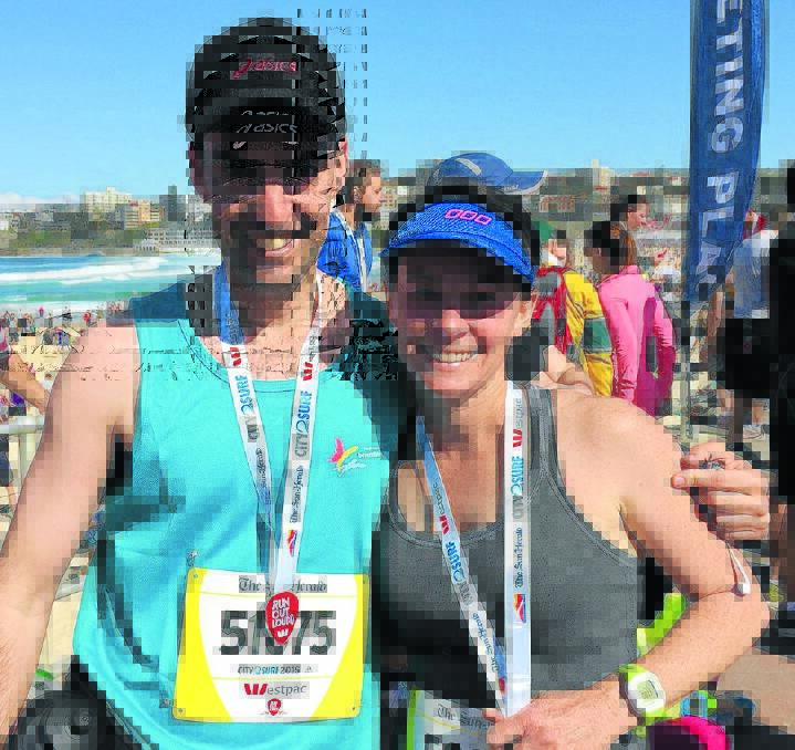 Gunnedah’s Nick Clark and Bec Dowe at the finish line of Sunday’s City2Surf at Bondi Beach.