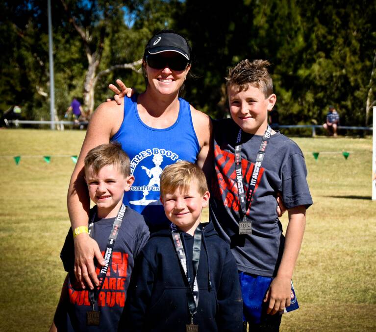 Natasha Fisher with her boys who also completed the mud run, Kurt, Chad and Jake.