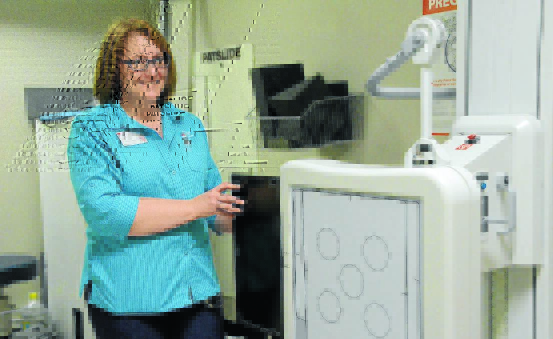 Radiographer Karyn Bond with the new X-ray equipment at the Gunnedah District Hospital.