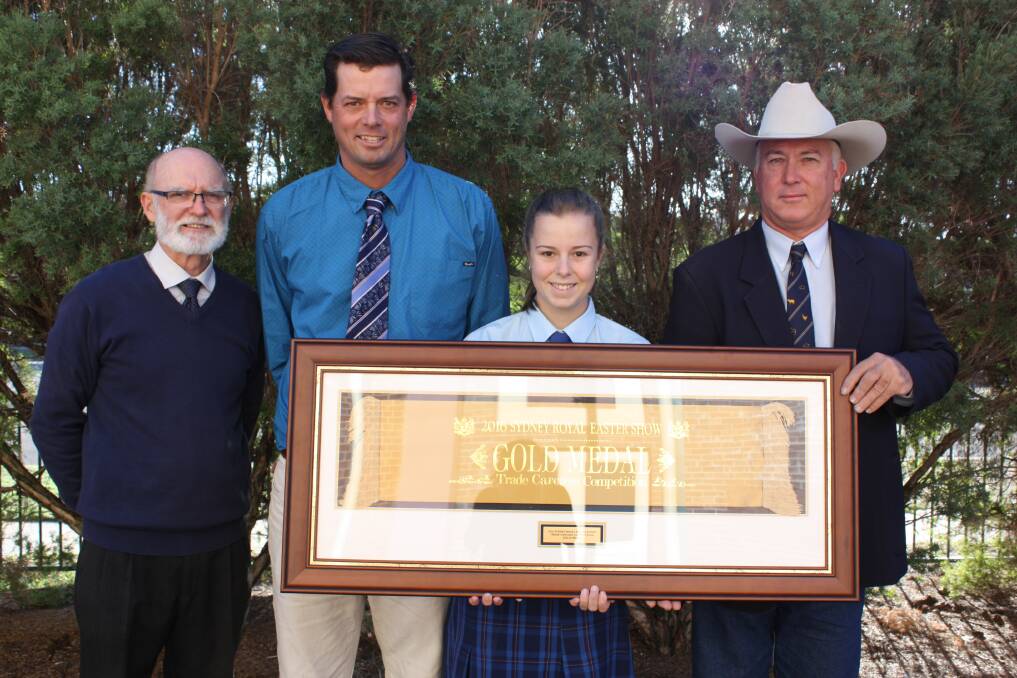 St Mary’s College principal Max Quirk, agriculture teacher Lachlan James, Year 12 agriculture student Ashlee van Os and cattle committee chair of the Royal Agricultural Society NSW, Greg Watson with the framed gold medal for a Murray Grey cross steer.