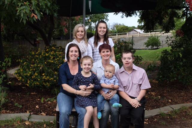 Lisa Warren (middle) with (clockwise from top left) some of her children: Daughters Ainsley and Sky, son Tom, grandson Jarvis, granddaughter Stella and daughter Emily.