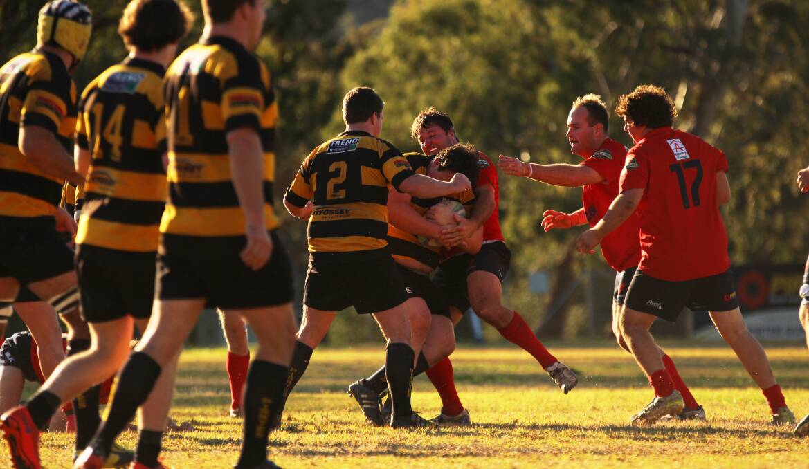 Gunnedah's Jamie Mitchell wraps up a Pirates attacker at Rugby Park on Saturday. Photo: Sam Woods