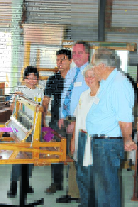 New England MP Barnaby Joyce with Fred and Marie Lawson and Andante International representatives Dr Mervvyn Koon and Joys Tan with one of the weaving looms. 