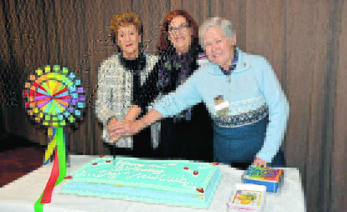 jean Smallpiece, left, Beryl Pike and Pat Jones cut the birthday cake.