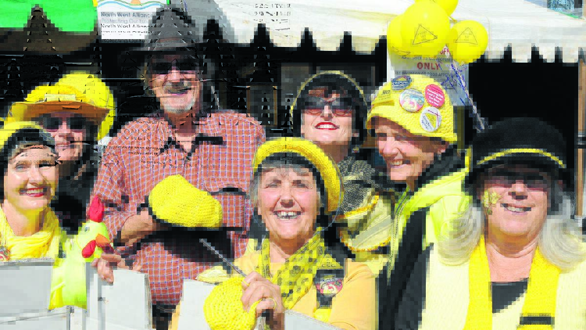 Standing in front of his own castle: Michael Caton with the Knitting Nannas, a group formed to grow the awareness of coal seam gas exploration and mining of prime agricultural land. 