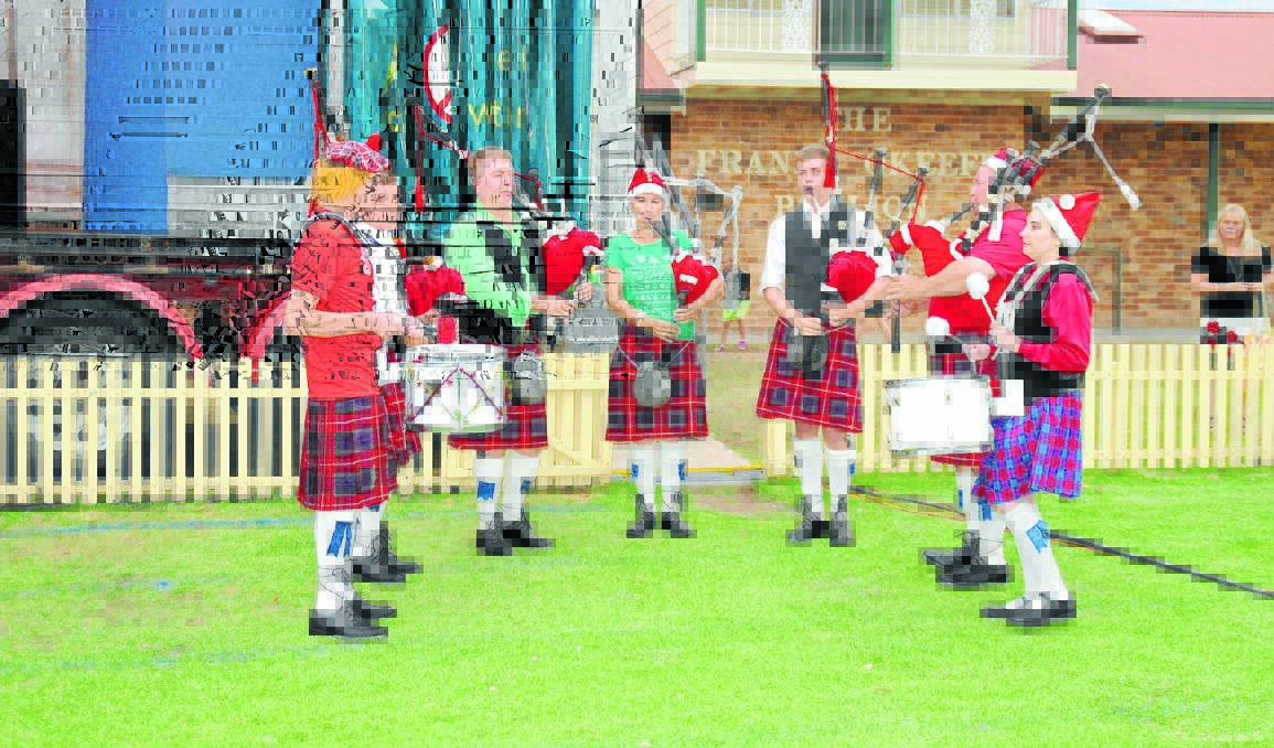 Members of Plains Pipes and Drums playing at Carols in the Park last year. Heather Martin is pictured in the centre.