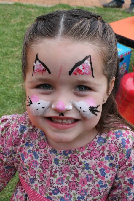  Eden Morgan opts for a cat face at the fund-raiser.