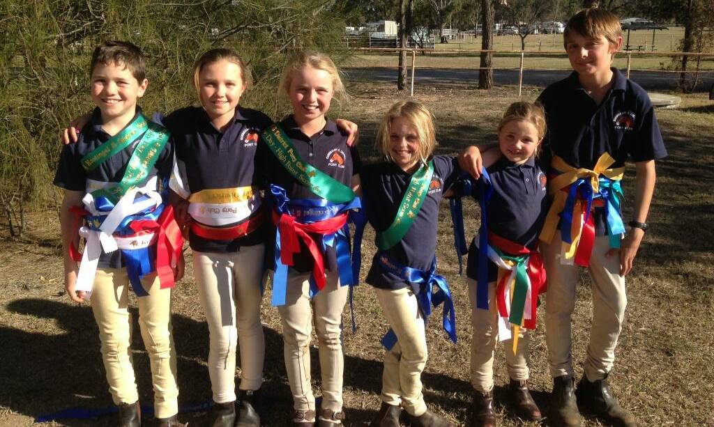 Gunnedah Pony Club riders Flynn Newberry, Eva Flannery, Harriet King, Daisy King, Scout Newberry and Philippe Altmann with their winning ribbons at Kootingal.