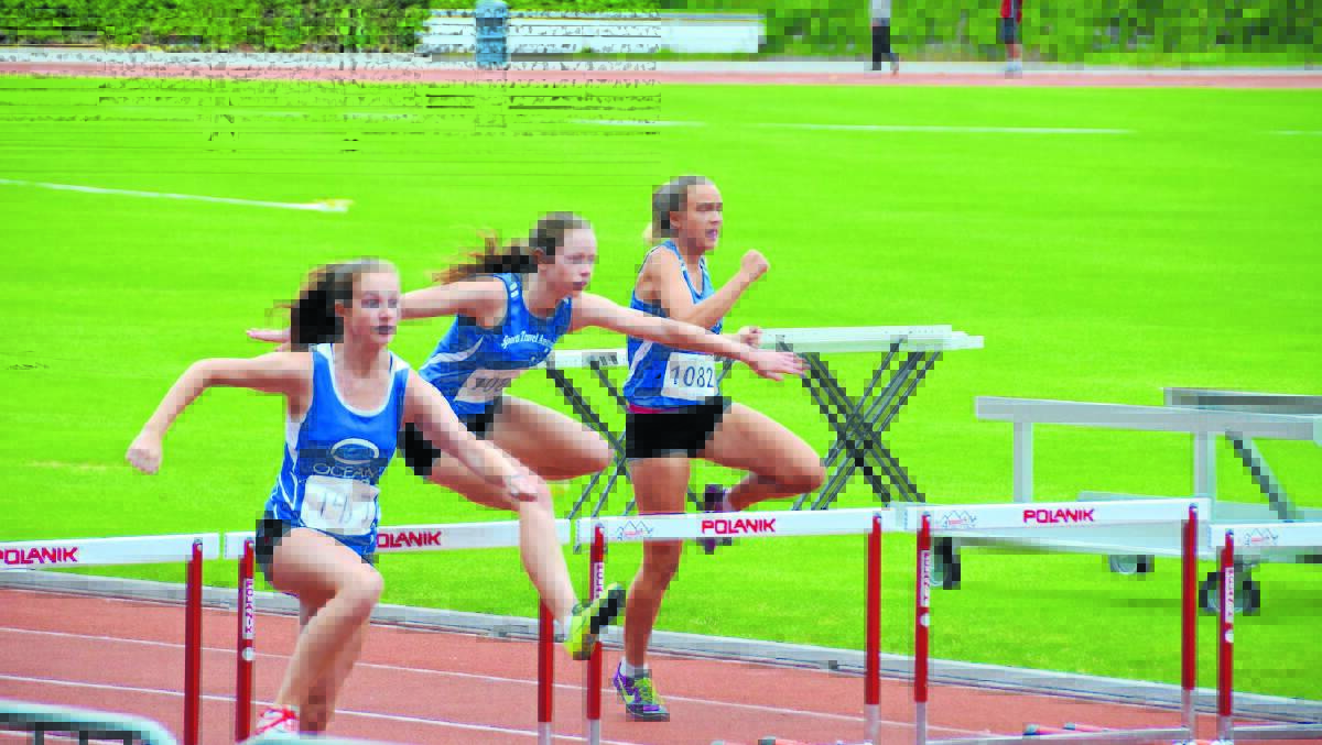 Gunnedah’s Emma Kennedy (centre) in action in 80m hurdles during her North American and Canadian  tour. 