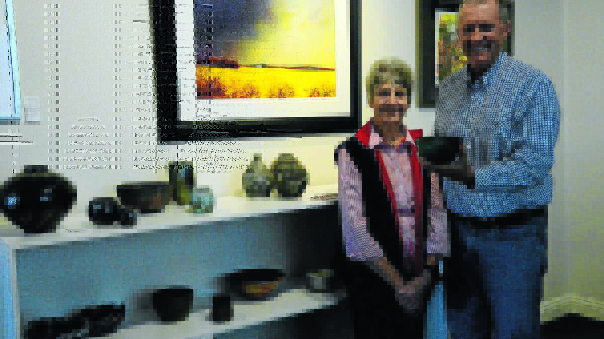 Gunnedah Pottery Club members are “All Fired Up” for this weekend’s exhibition. Teacher Pat Tobin, left, and president Geoff Dawson are among the artists whose work will be displayed.