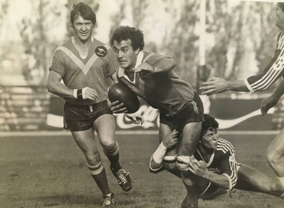 Boggabri's Col Gilham (left) supports team-mate Peter Eveleigh during a tackle.