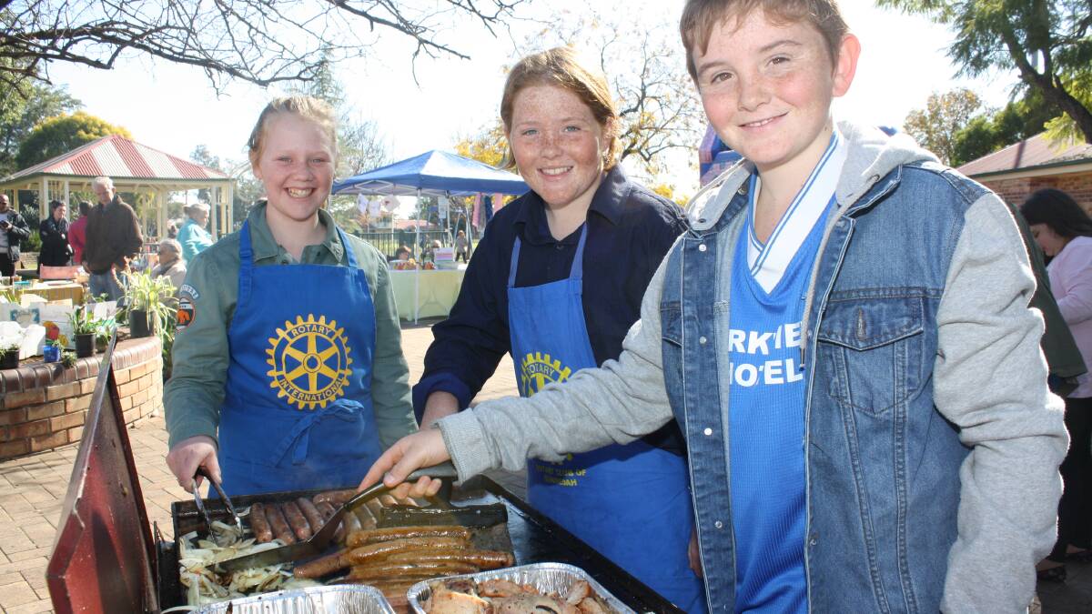 Year 6 St Xavier’s Primary School students Saige Mitchell and Eliza O’Donnell fund-raising with the help of Thomas O’Donnell at the ShelterBox  fund-raiser at the markets recently.