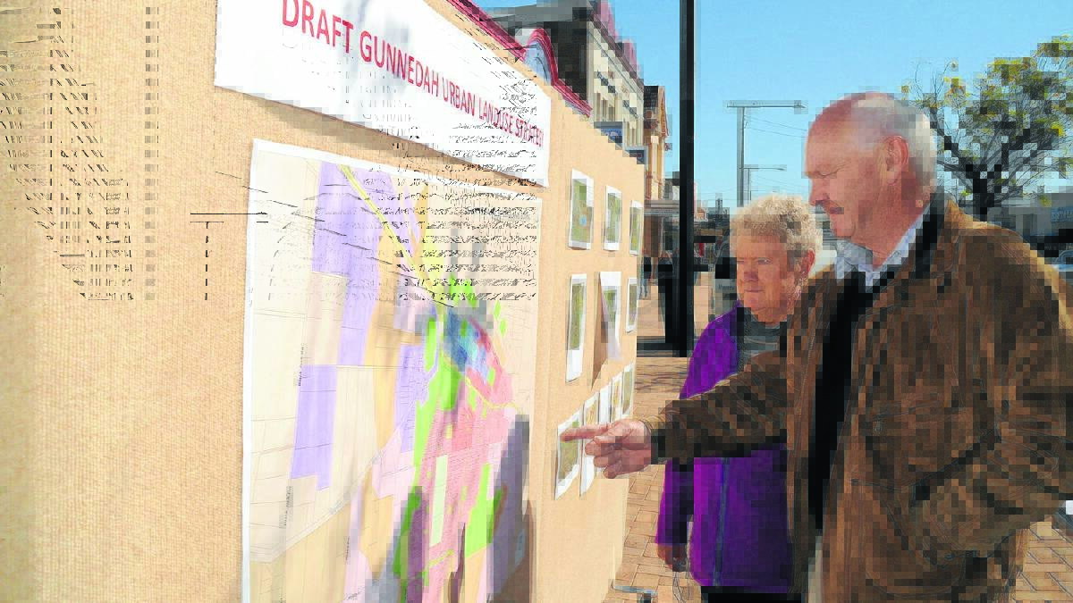 Gunnedah Shire Council’s director of planning and environmental services Michael Silver explains the strategy to Aylene Gale at a display in Conadilly Street on Wednesday.