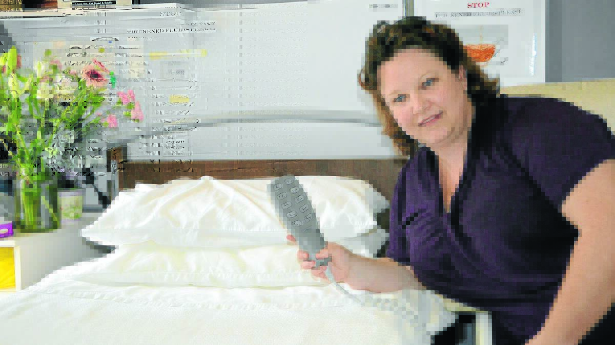 Manager of Care Service Jodie Parkes with one of the new state-of-the-art hospital beds. 