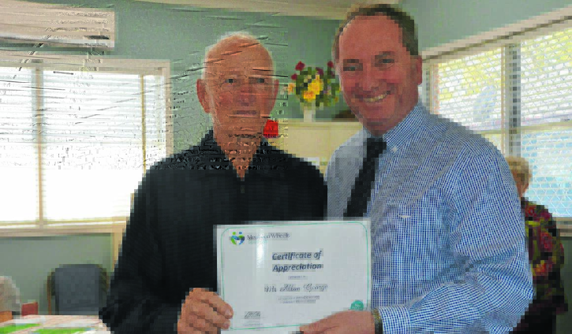 Alan George was recognised for his volunteering efforts with a certificate presented by Member for New England Barnaby Joyce.