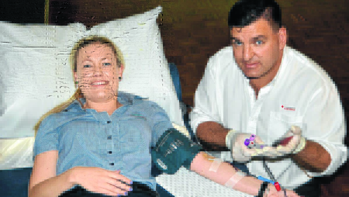 Kim Stone donates blood.