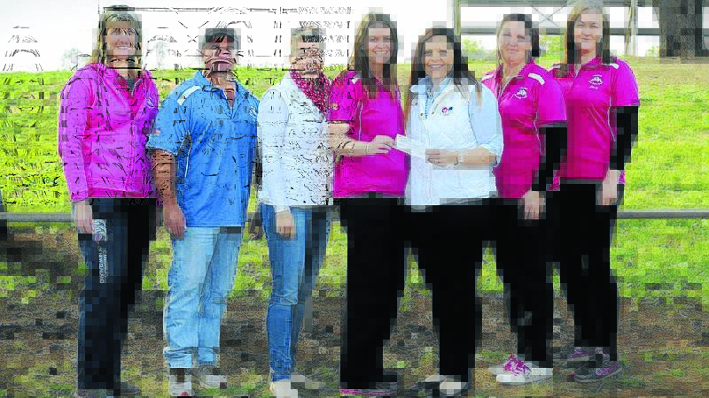 GJRL representatives accept the $500 donation from Buggalugs Photography. Pictured left: Sue Heinrich, Dan Burgess, Carly Donnelly, Michelle Shoesmith, Justine Knowles, Karen Garner and Susan Southwell.