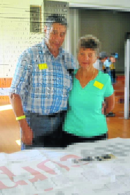 RAY Glenister, of Melbourne, showing his wife Kay where he fits in on the Natty-Griffiths family tree.