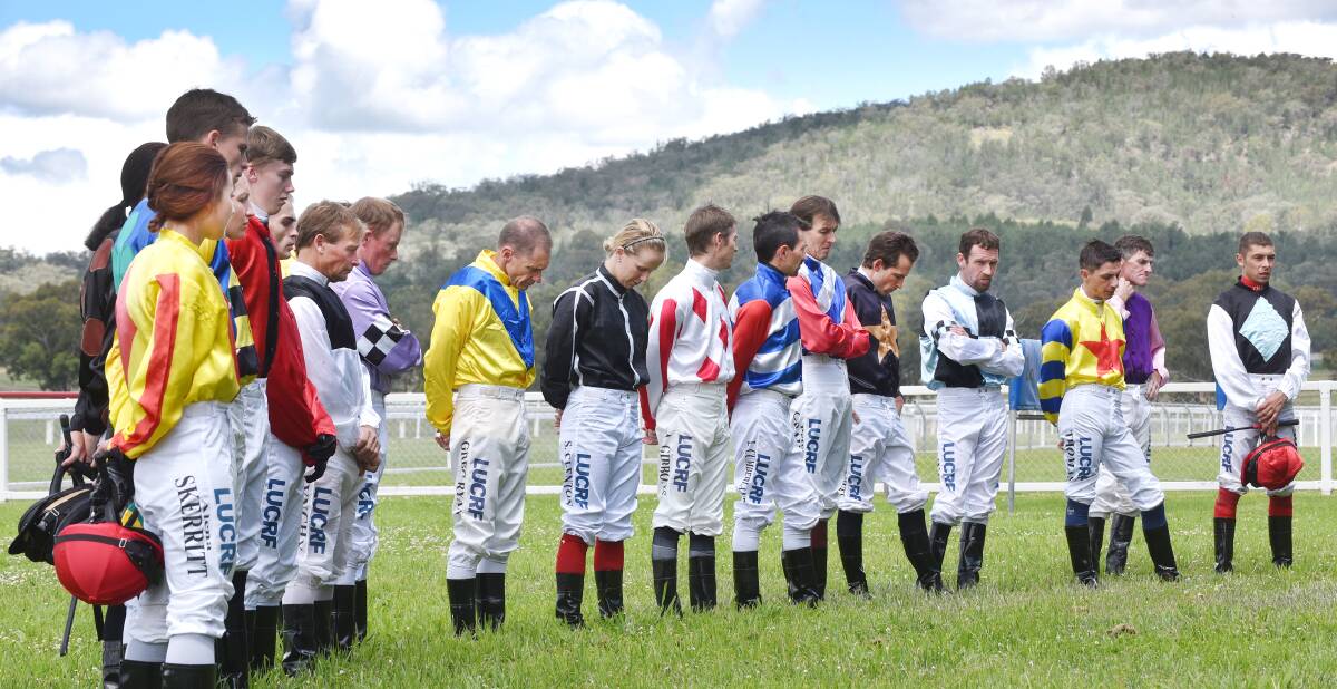 Jockeys at Quirindi show their respect for fellow  jockey Tim Bell.  Photo: Barry Smith 161115BSB03