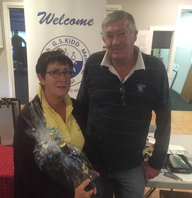 TOP PLACEGETTERS: Four-ball versus Par winners Alison Dawson-Bee and Wal Carter at the presentations following the charity golf day at Gunnedah on Sunday.