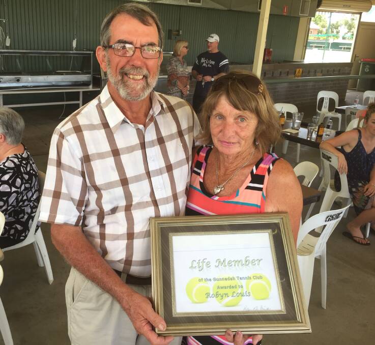 LIFE MEMBER: Robyn Louis (right) receives her Life Member award from Gunnedah Tennis Club president Robert White during the tennis club's presentation day at the Gunnedah Services and Bowling Club on Sunday.
