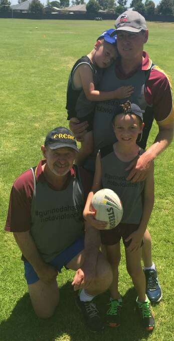 THREE GENERATIONS: David Jaeger with son Chris and grandsons Harvey and Chas at the annual family touch football gala day.