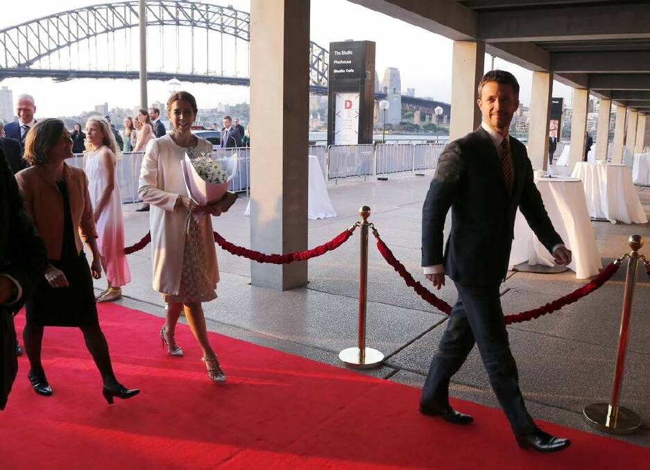 Denmark's Crown Prince Frederik (R) and his Australian-born wife Crown Princess Mary (2nd L) walk on a red carpet as they enter Sydney Opera House. Photo: David Gray